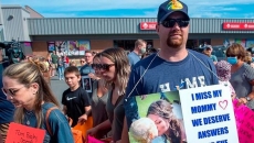 Shooting victims' families march for inquiry