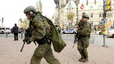 Man detained by police near where Harper lays wreath at war memorial