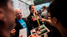 Canada's Olympic Athletes Return Home To Cheering Fans And Relatives