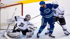 Kings blank Canucks, move into playoff spot