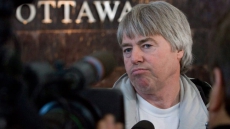 Federal Court overturns farmer Robert Latimer's travel restrictions