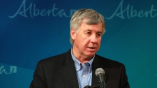 Alberta rolls back oil forecasts, expects price to remain mired in trough