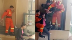 WATCH: Firefighter Walks On Narrow Ledge To Save Suicidal Woman On 15th Floor