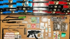 Surrey RCMP cash over $12K, drugs, and a loaded gun from residence, arrest 9