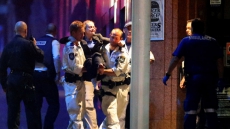 Gunman in Sydney hostage crisis was known to police: PM