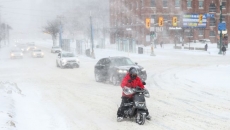 Schools closed, commuters face major delays as Toronto digs out after record snowfall