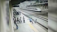 Video: Heroic Man Saves Suicidal Woman From Jumping In Front Of Train