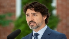 Trudeau says health trumps industry concerns as travel restrictions remain