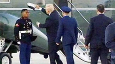 Watch: Donald Trump Helps Pick Up Marine's Hat Blown Away By The Wind