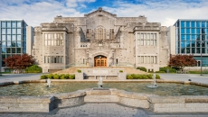 University director resigns after holiday travel