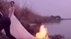 WATCH: Bride Let Photographer Set Fire On Her Gown Only To Take A Wedding Photo. How Far Will You Go