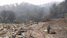 California fires claim 6 lives, threaten thousands of homes