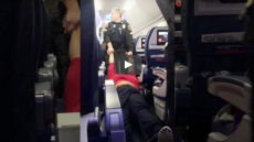 Watch How A Woman Was Dragged Out Of Plane