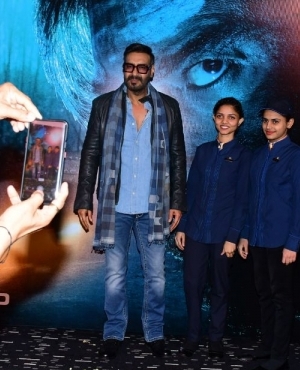 Ajay Devgn poses with his little fans 