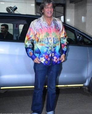  Chunkey Pandey looks great in a multicoloured shirt and jeans 