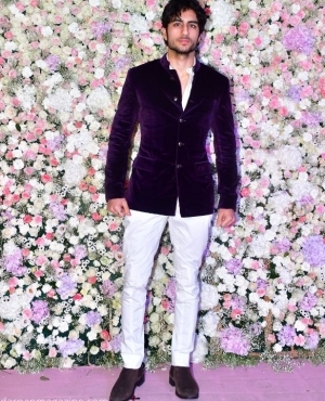 Ibrahim Ali Khan looks dapper in his purple jacket paired with white pants and shoes 