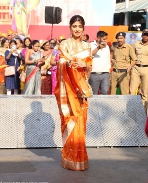 Shilpa Shetty looks gorgeous in her gold and orange saree 