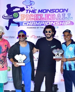 Aparshakti Khurana and Arjun Kapoor hold pickleball trophies 