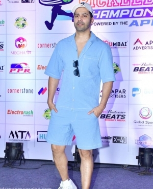 Varun Dhawan shows up dressed in a blue shirt and shorts 