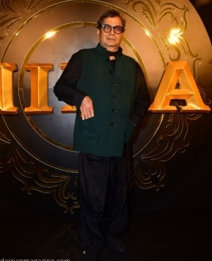 Director Subhash Ghai makes poses for the press 