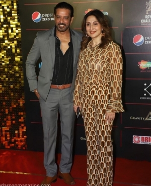 Anup Soni and wife pose for the press 