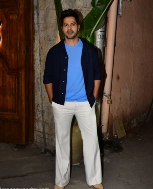 Varun Dhawan looks dapper as he poses for the press 