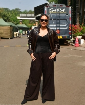 Sonakshi Sinha poses for the press with her sunglasses on 