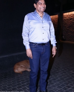 Comedian Johny Lever smiles for the press 