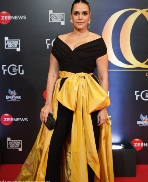 Neha Dhupia looks gorgeous in her black outfit with a hint of yellow 