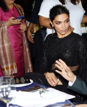 Deepika Padukone surrounded by fans at the event 