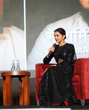 Deepika Padukone interacts with the host of the event 