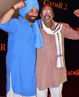 Sunny Deol dressed up in traditional clothing has some fun along side Nana Patekar 
