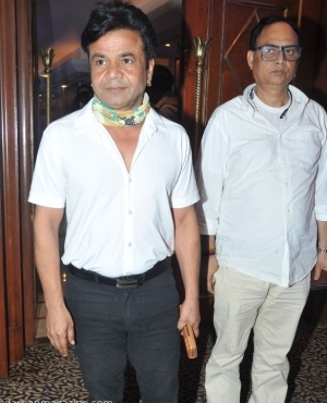 Rajpal Yadav poses for the press 