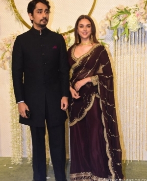 Aditi Rao Hydari makes an appearance in her beautiful purple saree alongside husband Siddharth 