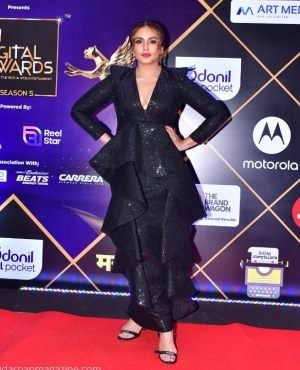 Huma Qureshi styles in a black shimmery dress 