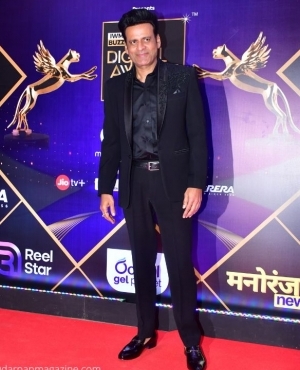 Manoj Bajpayee poses for the press 