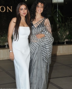 Kanika Dhillon looks beautiful in her white satin dress alongside Taapsee Pannu in her grey saree