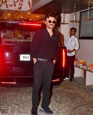 Anil Kapoor looks great with his sunglasses on 