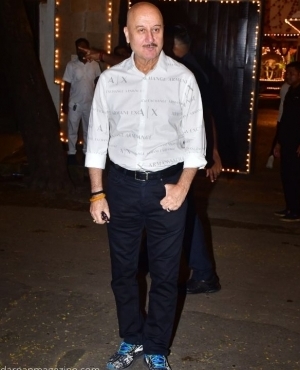 Anupam Kher poses for the press 