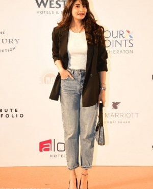 Daisy Shah looks goes for a cool casual look in jeans and a blazer 