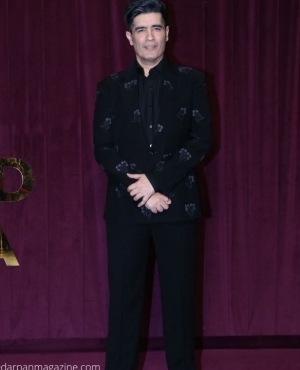 Manish Malhotra poses for the press 