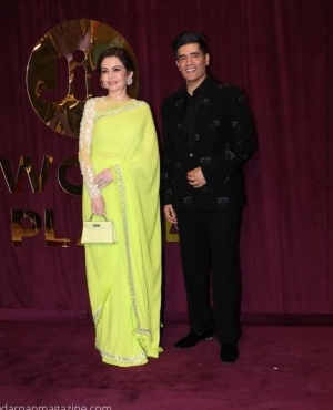 Nita Ambani poses alongside fashion designer Manish Malhotra 