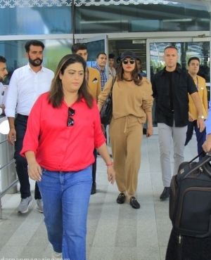 Priyanka arrives at the airport with her security team 