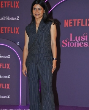 KonKona Sen Sharma is pin stripped in her jumpsuit 