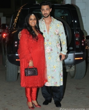 Arpita Khan wears a bold red suit alongside husband Aayush Sharma 