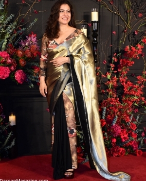 Kajol looks like a stunner in her gold and black saree 
