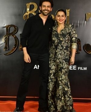 Kartik Aaryan and Vidya Balan pose together for the press 