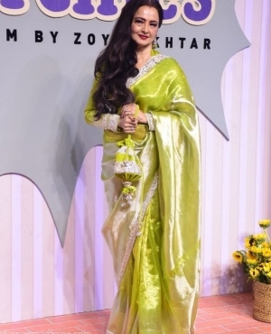 Rekhaji goes for a neon silver saree 