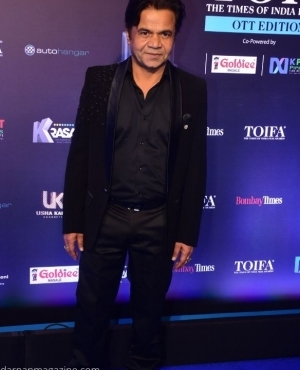 Rajpal Yadav poses for the press 