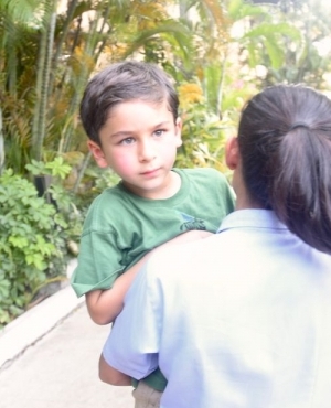 Taimur Ail Khan poses for the press and makes eye contact with his beautiful green eyes 